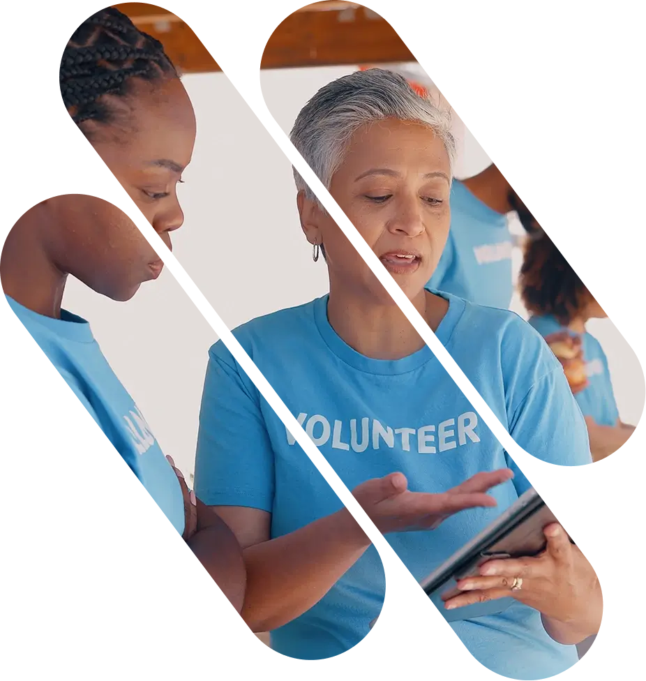 Volunteers discussing plans using a tablet
